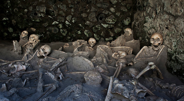 Check image. These people died of thermal shock. Ash eruption?